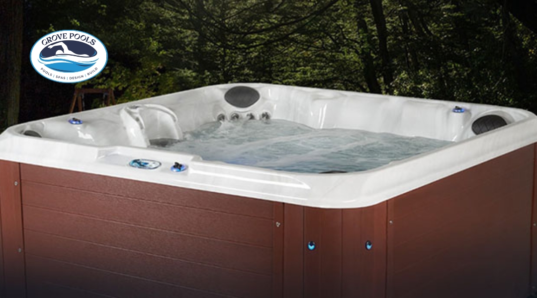 Hot tub with strong water jets, featuring a sleek white interior and brown wood paneling. Logo for Grove Pools is displayed at the top left corner.